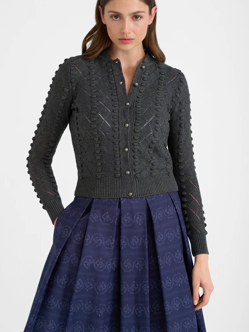 Strickjacke mit Stehkragen und Bommeln