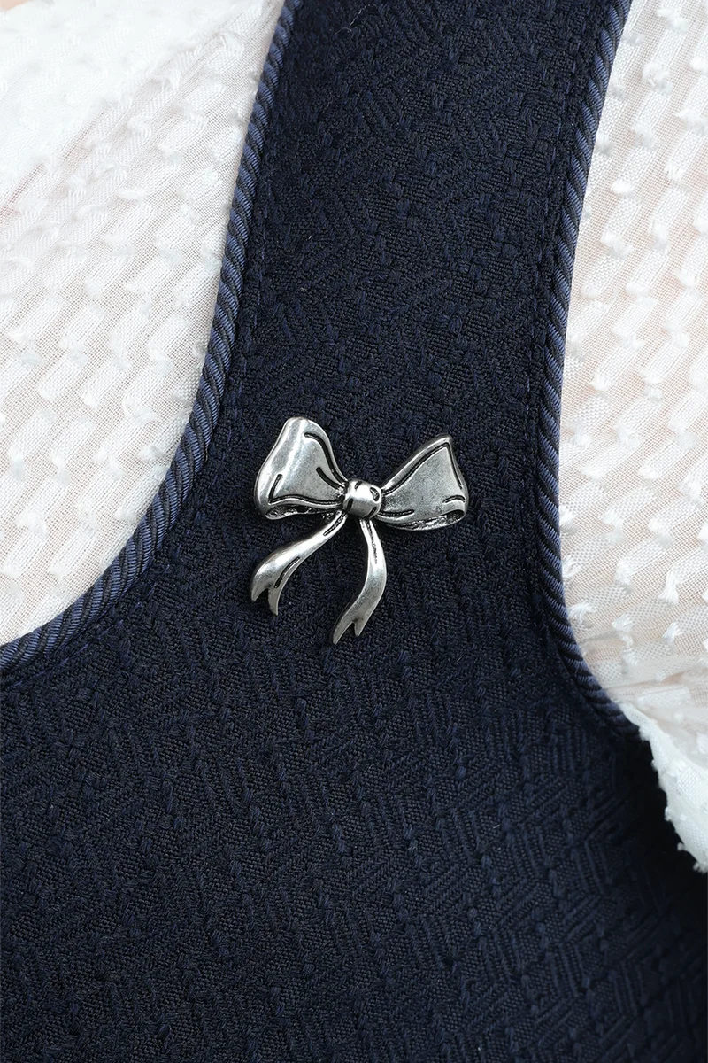 Pin geschwungene Schleife - altsilber